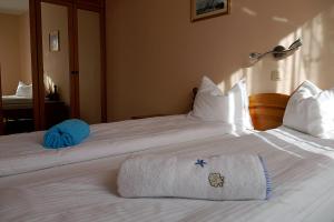 Łóżko lub łóżka w pokoju w obiekcie Apartamenty Klemens