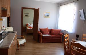 Telewizja i/lub zestaw kina domowego w obiekcie Apartamenty Klemens