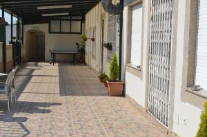 an empty hallway of a building with a table at Casa Alonso in Narón