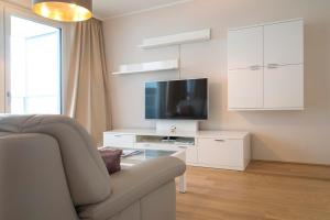 Sjónvarps- og/eða afþreyingartæki á Sofie Apartments