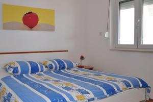 Ein Bett oder Betten in einem Zimmer der Unterkunft BM Apartments Rogoznica
