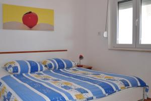 Posteľ alebo postele v izbe v ubytovaní BM Apartments Rogoznica