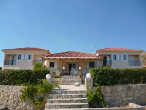 a house with a staircase in front of it at Gouna's Aparts in Xi