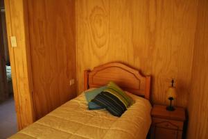Uma cama ou camas num quarto em Rosa Herminia