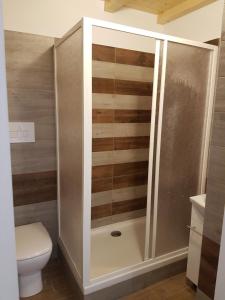 a bathroom with a shower and a toilet at Il corso Favignana in Favignana