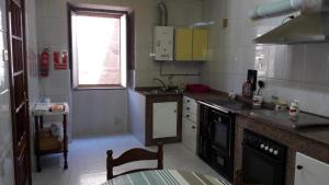 a small kitchen with a sink and a counter top at Casa Rural Goltar in Goltar