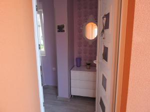 a bathroom with a sink and a mirror at Apartments Perla in Biograd na Moru +154 photos