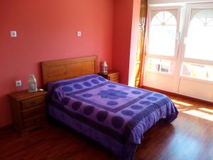 Кровать или кровати в номере Albergue de Peregrinos La Espiral