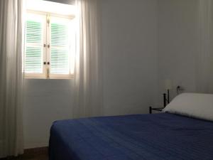 Posteľ alebo postele v izbe v ubytovaní Apartamentos Casa la Costanilla