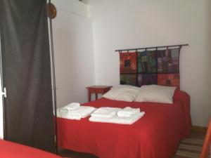 Posteľ alebo postele v izbe v ubytovaní Apartamentos Casa la Costanilla
