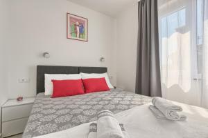Postel nebo postele na pokoji v ubytování Ancora Center Apartment