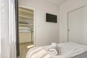Postel nebo postele na pokoji v ubytování Ancora Center Apartment