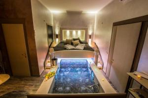 A bed or beds in a room at Roma d'Amore