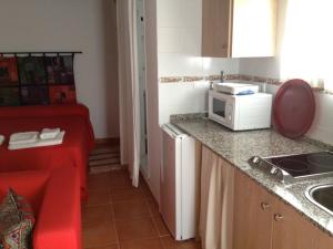 Kuchyňa alebo kuchynka v ubytovaní Apartamentos Casa la Costanilla