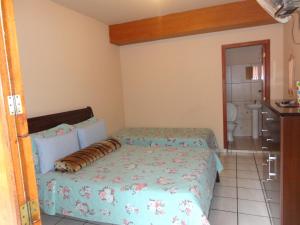 Giường trong phòng chung tại Pousada Terra Nossa