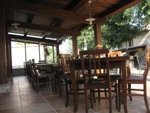 a wooden table and chairs on a patio at Pietra Maula Agriturismo in Castelraimondo