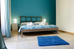 Bahlara Case Vacanza tesisinde bir odada yatak veya yataklar