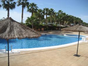 Bazén v ubytování 1ª Linea Playa Deluxe Costa Marina nebo v jeho okolí