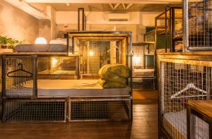 a room with several cages of birds in a building at Wontonmeen in Hong Kong