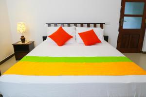 Giường trong phòng chung tại Miyura Holiday Bungalow +5 ảnh