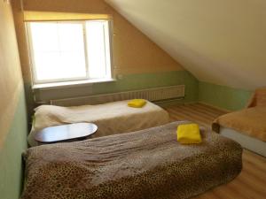 Postel nebo postele na pokoji v ubytování Viva Pirita Hostel