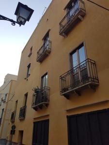 a building with balconies on the side of it at Appartamento Acquamarina in Trapani