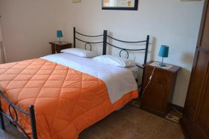 Ένα ή περισσότερα κρεβάτια σε δωμάτιο στο La Casa di Antonella