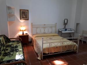 Postel nebo postele na pokoji v ubytování Villa Teseo + 37 fotografií