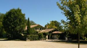 a house with a bench in front of it at La Ferme de Gringalet in Anthon