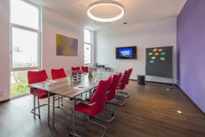 Uma TV ou centro de entretenimento em Star G Hotel Premium München Domagkstraße