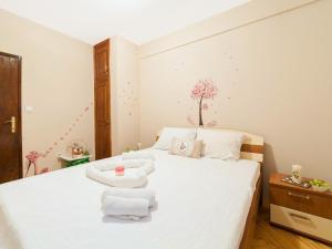 מיטה או מיטות בחדר ב-Holiday House Stari Volat
