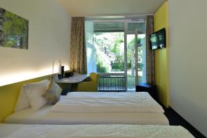 Postel nebo postele na pokoji v ubytování Hotel Sommerau + 37 fotografií