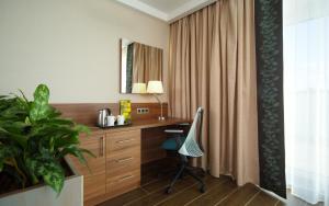 a room with a desk and a window at Hilton Garden Inn Moscow Krasnoselskaya in Moscow
