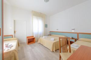 Postel nebo postele na pokoji v ubytování Hotel Sirena