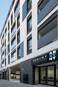 an apartment building with a sign on the front of it at Apartment Dąbrowskiego by The Railway Station Wroclaw in Wrocław