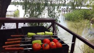 a basket full of fruits and vegetables on a rail at Villa Mango in Vylkove +32 photos