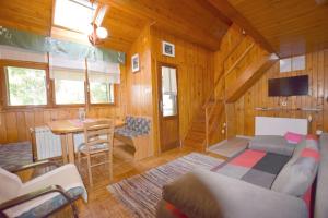 a living room with a couch and a table at Holiday Home Bruno in Vrbovsko