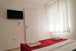 Postel nebo postele na pokoji v ubytování Lenka Apartments I
