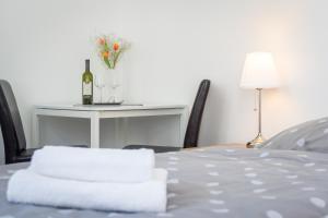 Postel nebo postele na pokoji v ubytování Penzion Apartmány Hradební