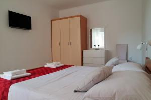 Postel nebo postele na pokoji v ubytování Lenka Apartments I