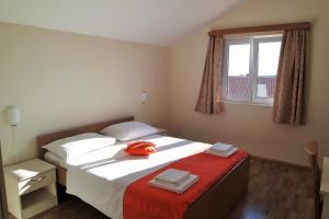 Postel nebo postele na pokoji v ubytování Lenka Apartments I