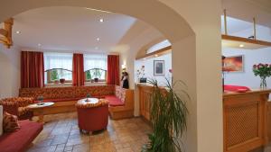 a living room with a couch and a table at Hotel-Garni Weidacherhof in Leutasch