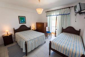 Postel nebo postele na pokoji v ubytování Guesthouse A Lareira