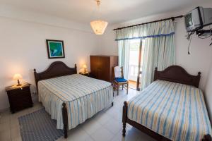 Ένα ή περισσότερα κρεβάτια σε δωμάτιο στο Guesthouse A Lareira