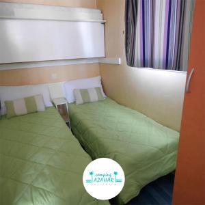 Postel nebo postele na pokoji v ubytování Camping Azahar