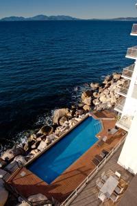 an aerial view of a swimming pool on the ocean at Penthouse on Bright Point in Nelly Bay