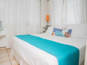 Postel nebo postele na pokoji v ubytování Hotel Neptuno Refugio