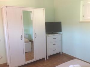 TV a/nebo společenská místnost v ubytování Casa Tacconi