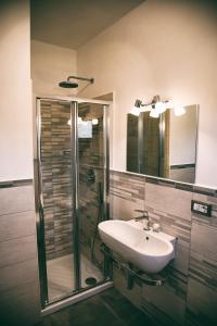 a bathroom with a sink and a shower at Alba Magica in Agerola +39 photos