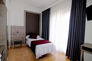 Кровать или кровати в номере Hotel Vibra Marco Polo II - Adults only